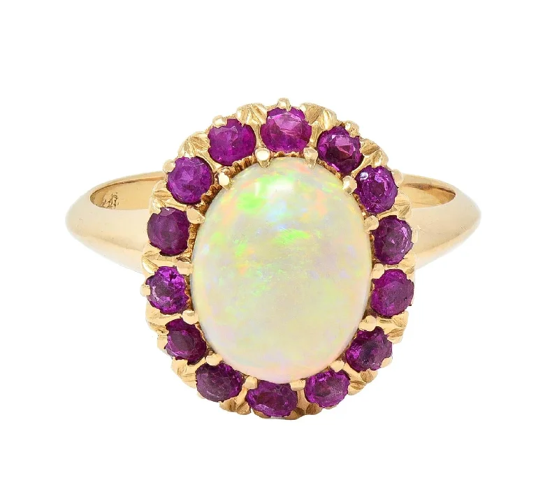 Huge Savings On Timeless Jewelry Collections Retro Pink Sapphire Opal 14 Karat Yellow Gold Vintage Halo Ring Huge Savings On Timeless Jewelry Collections Retro Pink Sapphire Opal 14 Karat Yellow Gold Vintage Halo Ring