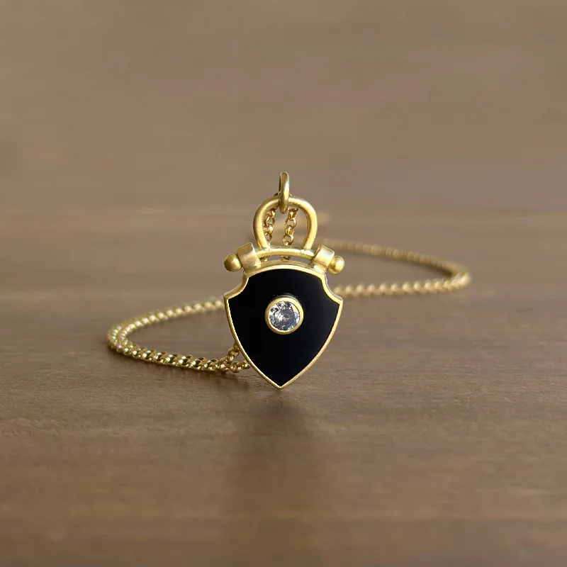 Shop Dazzling Jewelry With Special Promotional Discounts Curved Top Onyx Shield Pendant with Diamond Shop Dazzling Jewelry With Special Promotional Discounts Curved Top Onyx Shield Pendant with Diamond