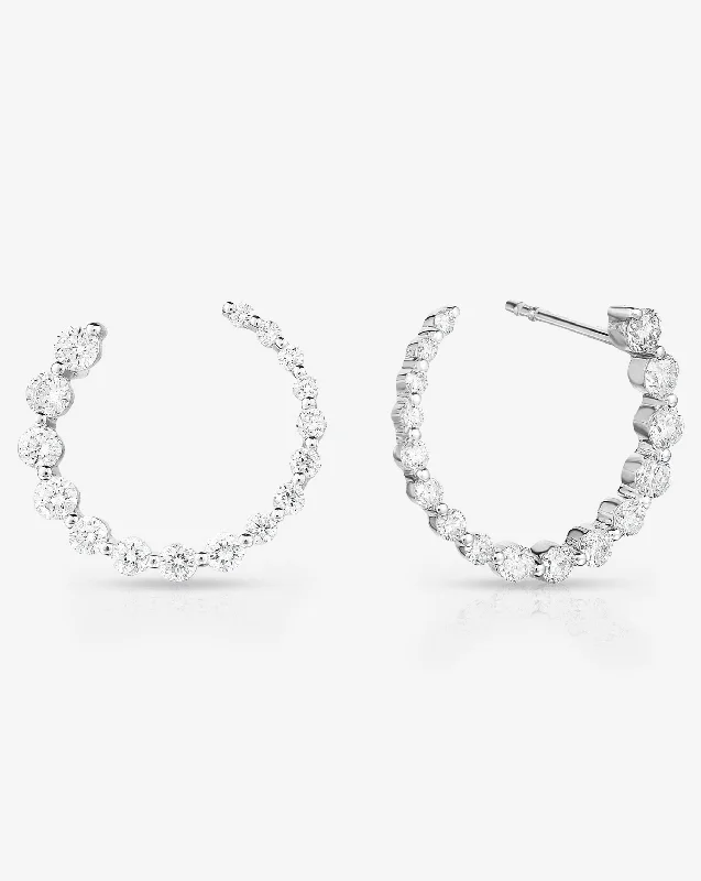 Elevate Your Outfit With Discounted Statement Jewelry Graduated Single Prong Diamond Circle Studs