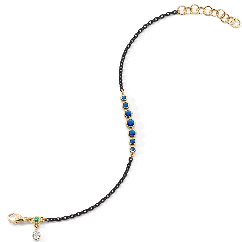 Trending Jewelry Styles Now At Limited-Time Discounts Bezel Set Round Blue Sapphire and Black Steel Tennis Bracelet